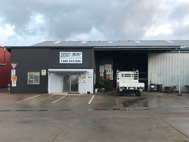 Kwik Lift Sunshine Coast depot with signage and service vehicles